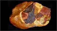 A silcrete nodule exhibiting the signs of experimental heat-treatment. Photocredit: Science/AAAS. (View Larger)