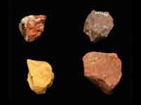 Pieces of ochre excavated in Qafzeh, Israel, suggesting intentional burial. Photocredit: James Di Loreto, & Donald H. Hurlbert, Smithsonian Institution. (View Larger)